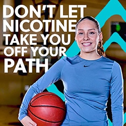 A female basketball player with a message encouraging viewers to stay away from nicotine.
