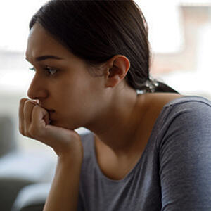 a young woman looking anxious